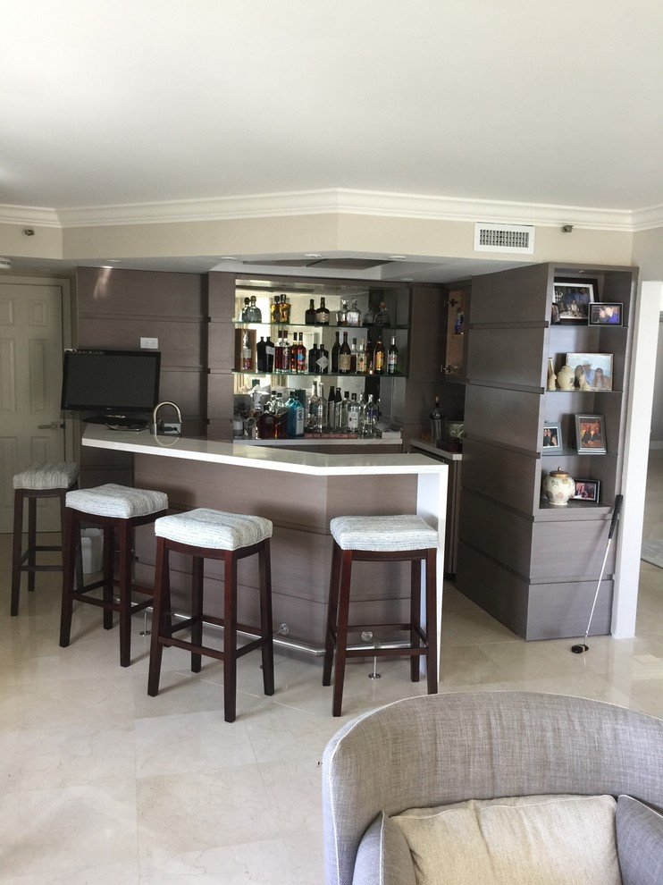 Inspiration for a mid-sized transitional u-shaped seated home bar in Miami with an undermount sink, open cabinets, light wood cabinets, quartz benchtops, mirror splashback, porcelain floors, beige floor and white benchtop.