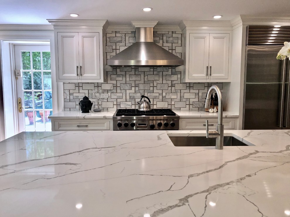 Large transitional eat-in kitchen photo in New York with beaded inset cabinets, gray cabinets, quartz countertops and an island