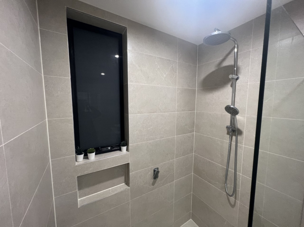 Design ideas for a mid-sized modern master bathroom in Sydney with beaded inset cabinets, white cabinets, an open shower, a one-piece toilet, beige tile, ceramic tile, beige walls, ceramic floors, a vessel sink, quartzite benchtops, beige floor, an open shower, white benchtops, a single vanity, a freestanding vanity and recessed.