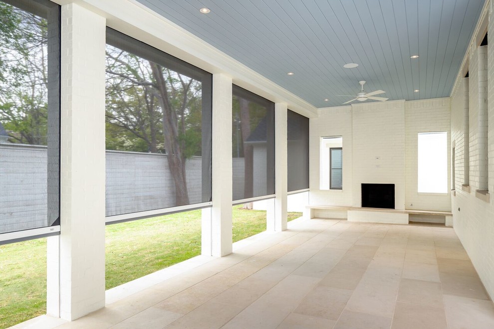 Large traditional backyard screened-in verandah in Dallas with concrete pavers and a roof extension.
