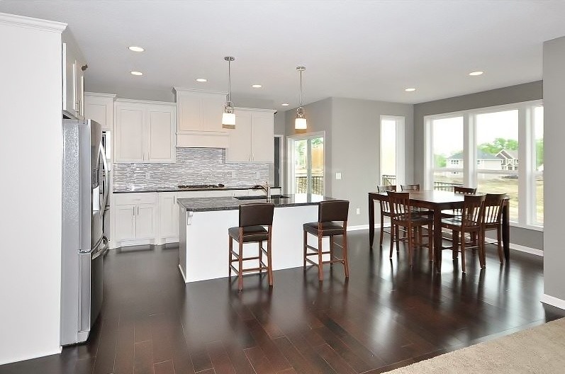 Inspiration for a mid-sized eat-in kitchen remodel in Minneapolis with an island