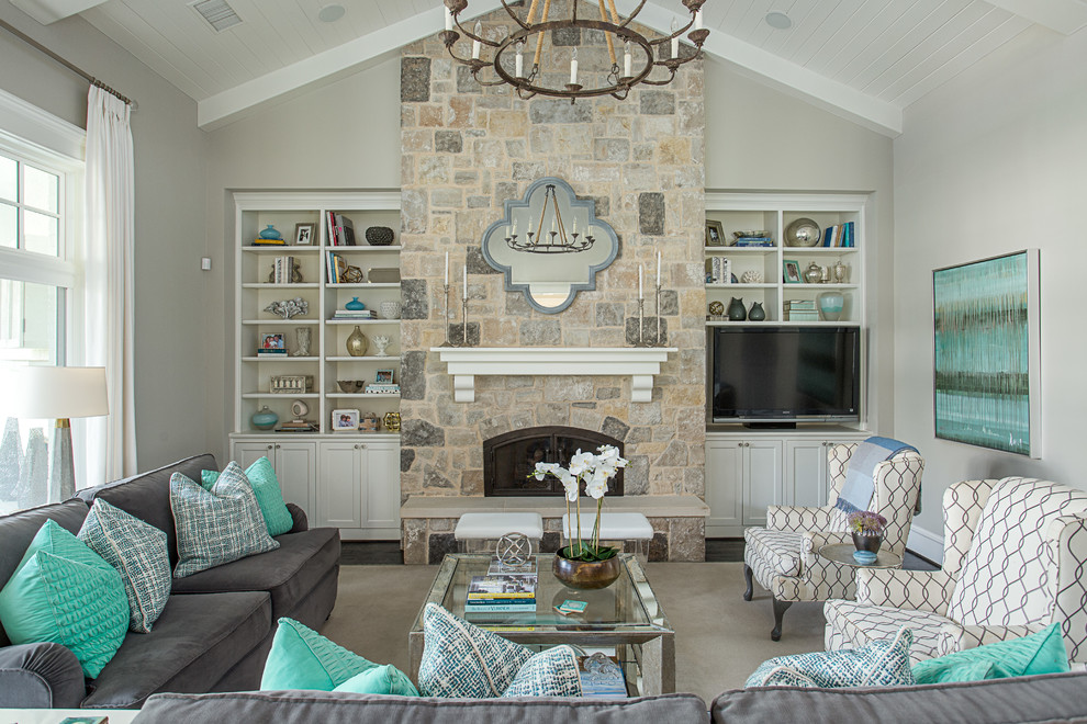Photo of a beach style family room in Dallas with grey walls, dark hardwood floors, a standard fireplace, a stone fireplace surround and a built-in media wall.
