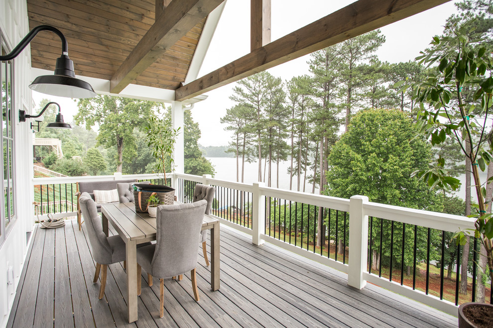Design ideas for a country deck in Charlotte with a roof extension.