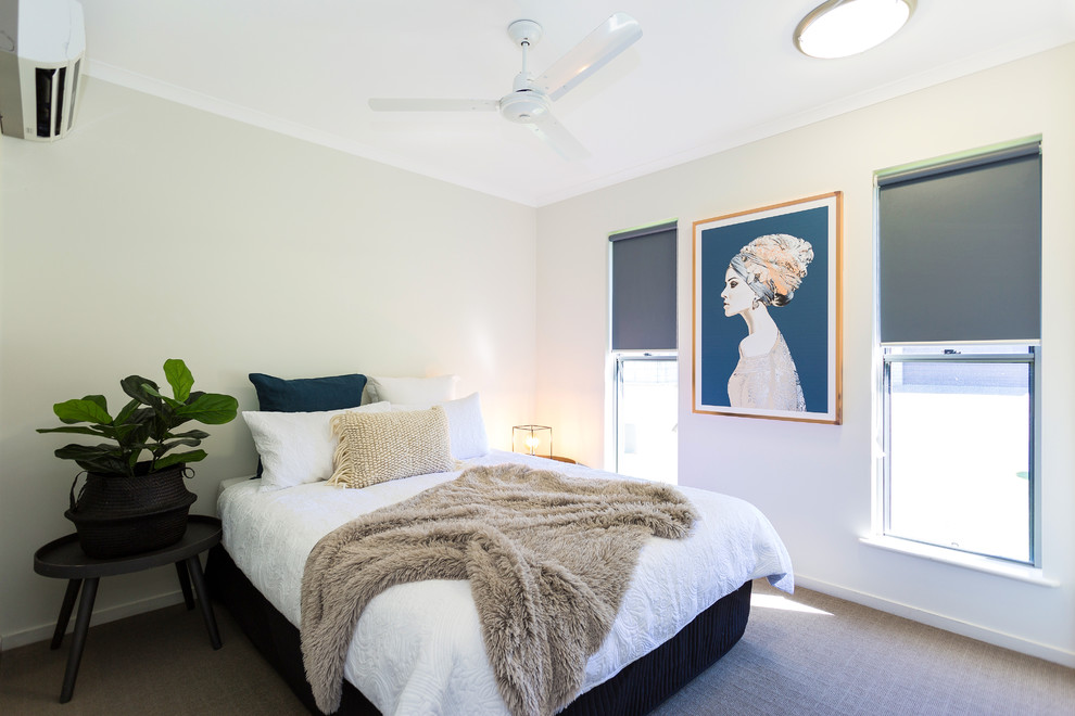 This is an example of a transitional bedroom in Brisbane with beige walls, no fireplace and beige floor.