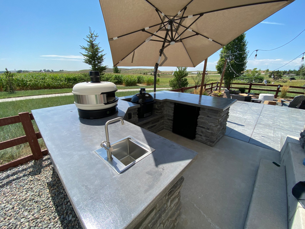 Rustic Reverie: Custom Concrete and Stone Unite in Your Outdoor Culinary Haven