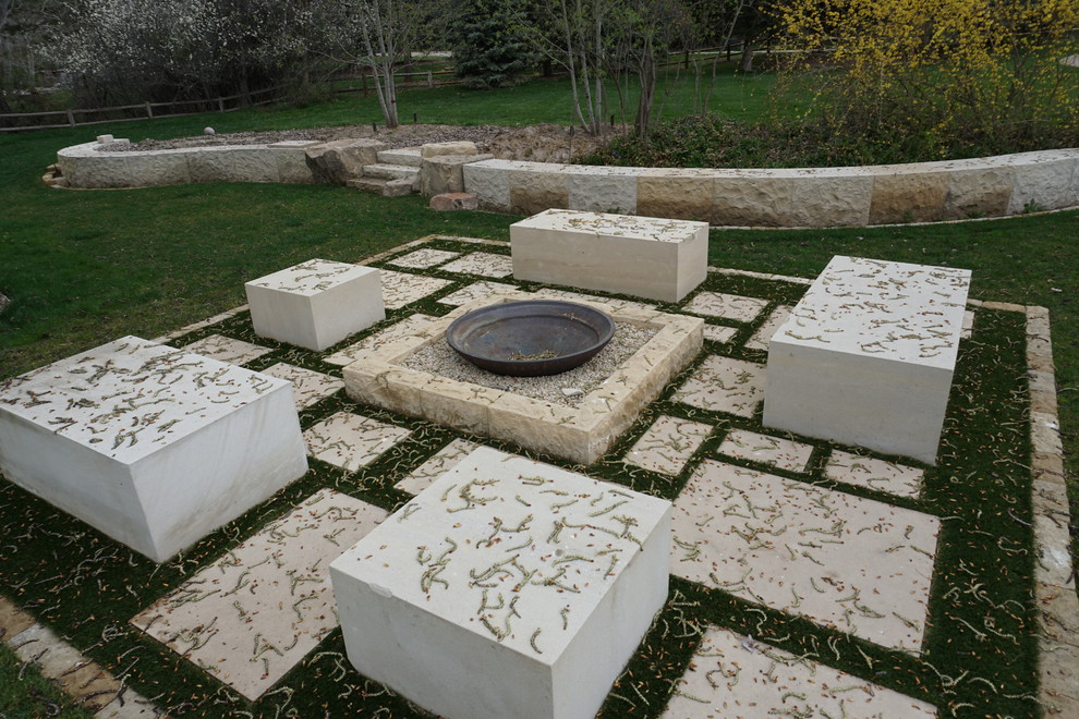 Inspiration for a large traditional backyard full sun garden in Boise with a fire feature and concrete pavers.