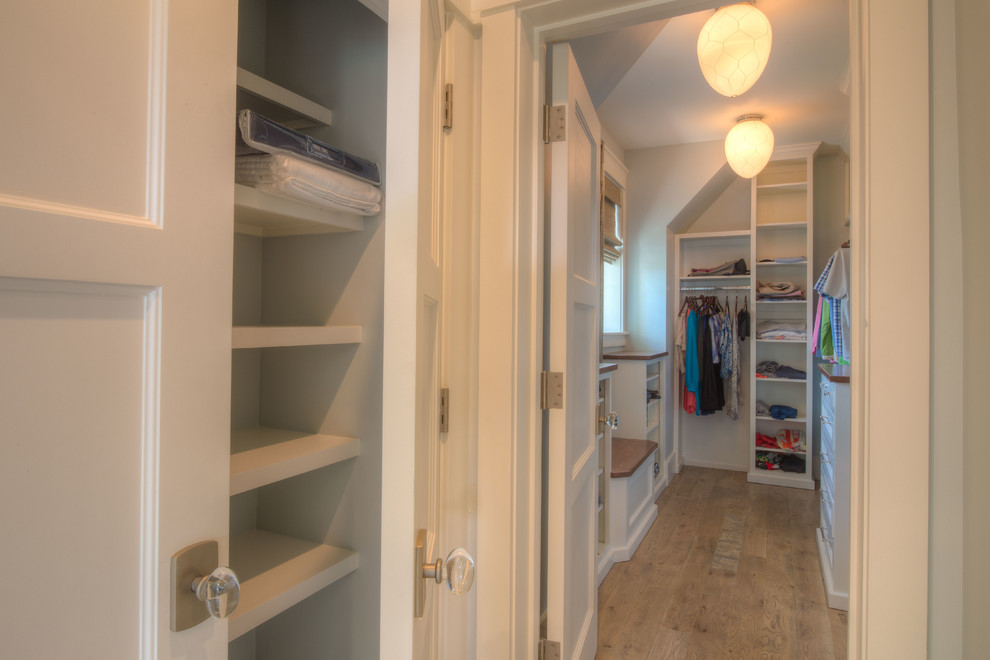 This is an example of a beach style storage and wardrobe in Miami.