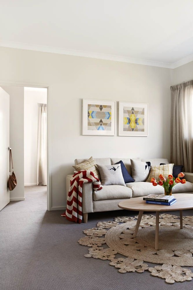Mid-sized contemporary open concept living room in Melbourne with beige walls, carpet, no fireplace and no tv.