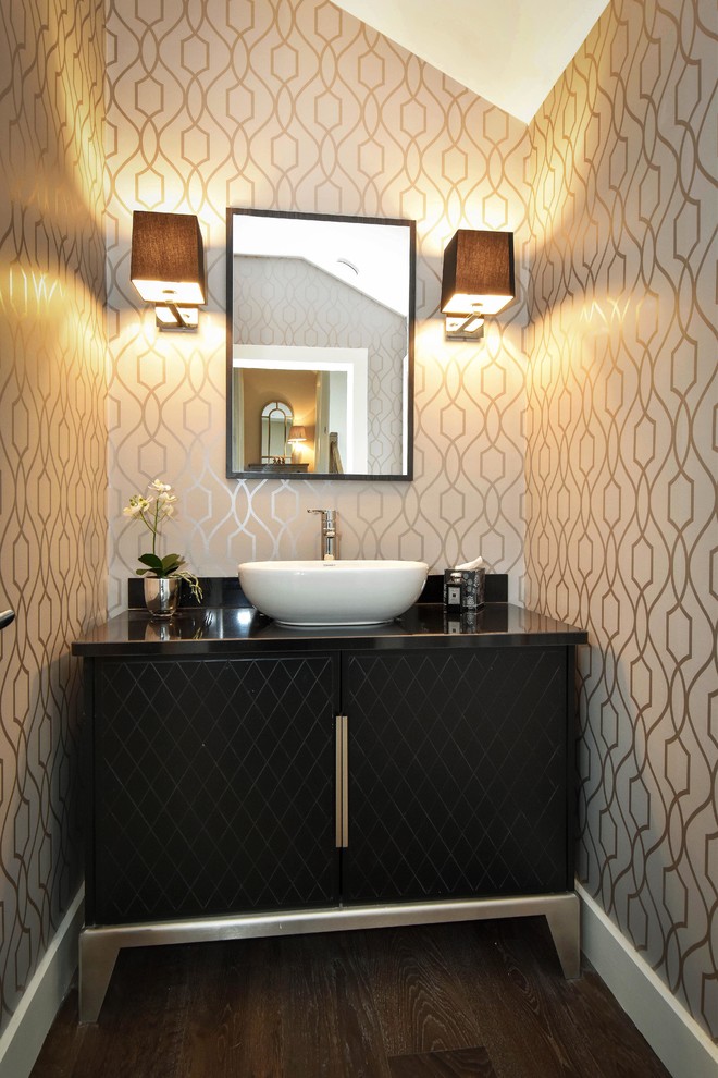 Inspiration for a transitional powder room in Other with black benchtops.