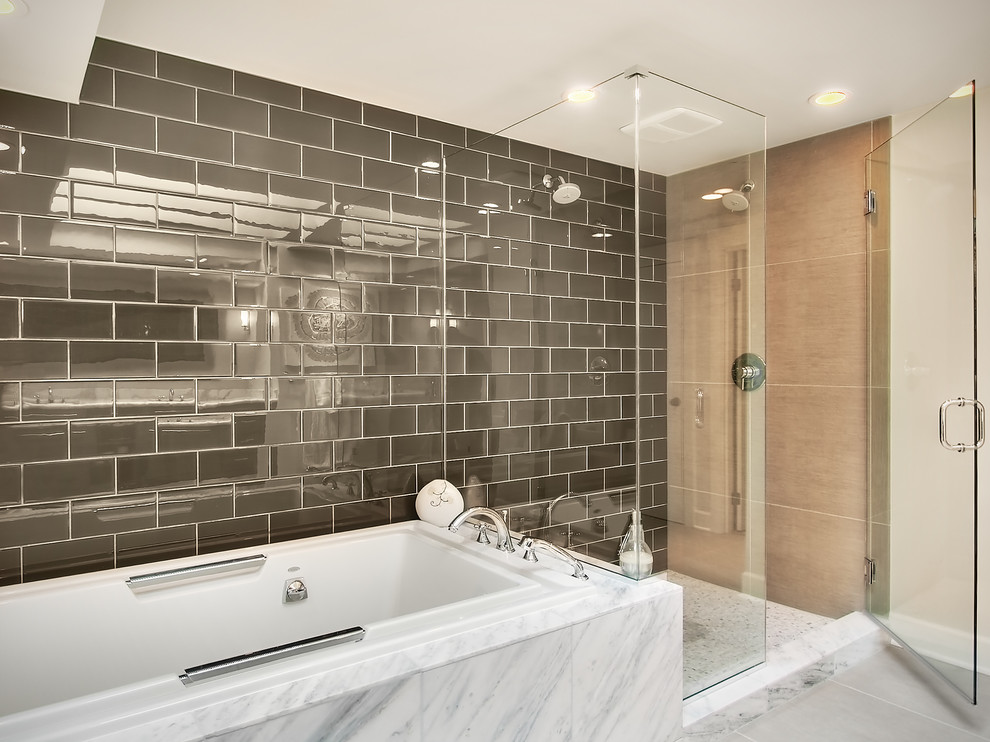 Design ideas for a mid-sized contemporary master bathroom in Seattle with a drop-in tub, a double shower, gray tile, subway tile and beige walls.
