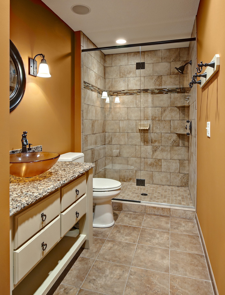 Inspiration for a traditional bathroom in Minneapolis with a vessel sink and orange walls.