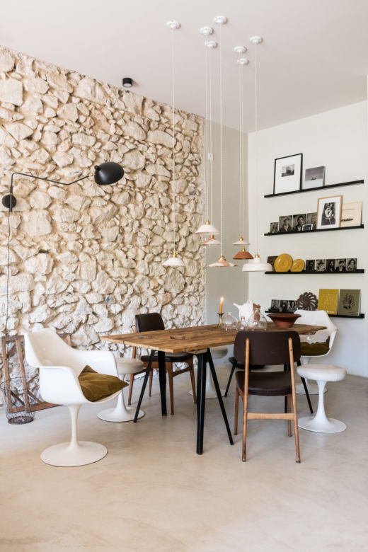 This is an example of a mediterranean dining room in Marseille with concrete floors.