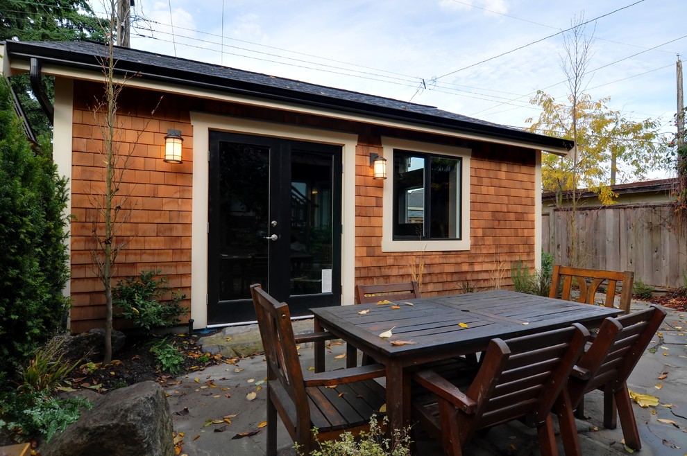 Example of a mid-sized transitional detached studio / workshop shed design in Other