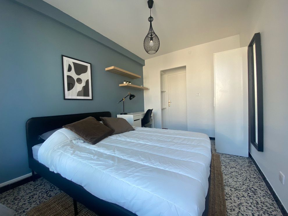 Design ideas for a medium sized contemporary guest bedroom in Marseille with blue walls, ceramic flooring and multi-coloured floors.