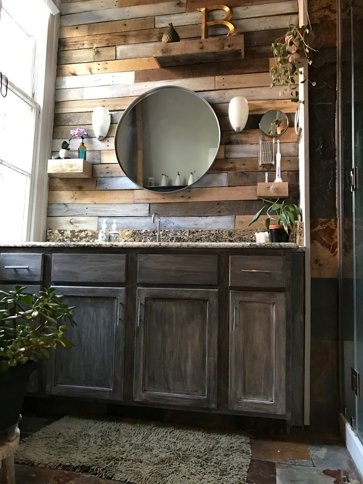 Inspiration for a mid-sized country master bathroom in New Orleans with recessed-panel cabinets, distressed cabinets, a one-piece toilet, multi-coloured tile, mirror tile, grey walls, slate floors, an undermount sink, granite benchtops, multi-coloured floor and a hinged shower door.