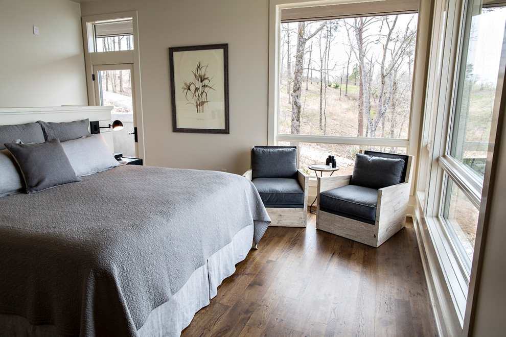 Photo of a mid-sized transitional guest bedroom in Birmingham with beige walls, dark hardwood floors and brown floor.