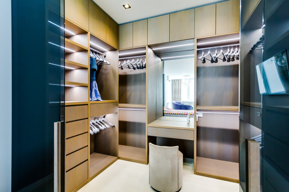 Inspiration for a contemporary dressing room in Other with beige cabinets and white floor.