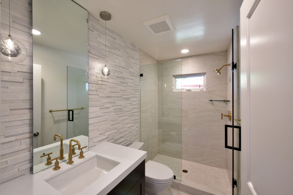 Design ideas for a transitional 3/4 bathroom in San Diego with shaker cabinets, an alcove shower, white tile, an undermount sink and a hinged shower door.