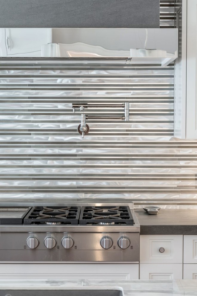 Example of a large transitional galley porcelain tile eat-in kitchen design in New York with a double-bowl sink, shaker cabinets, white cabinets, marble countertops, multicolored backsplash, porcelain backsplash, stainless steel appliances and an island