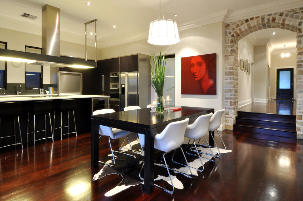 Inspiration for a mid-sized contemporary kitchen/dining combo in Perth with beige walls, dark hardwood floors and no fireplace.