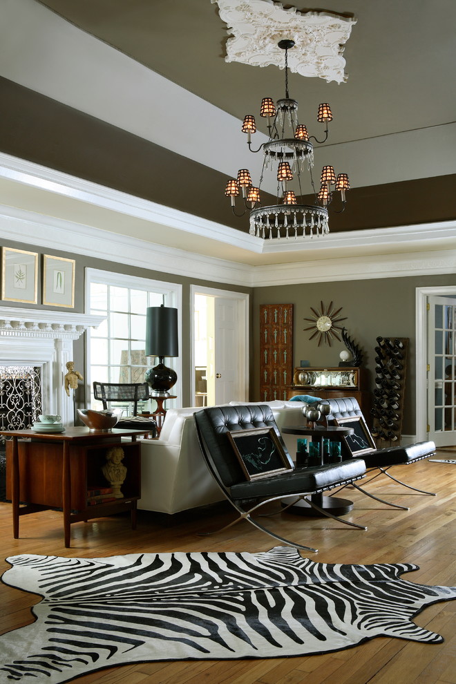 Inspiration for a large eclectic formal open concept living room in Atlanta with medium hardwood floors, a standard fireplace, grey walls and no tv.