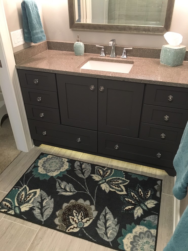 Example of a small transitional kids' gray tile and porcelain tile porcelain tile alcove bathtub design in Milwaukee with shaker cabinets, gray cabinets, a two-piece toilet, gray walls, an undermount sink and solid surface countertops