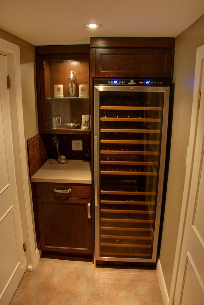 This is an example of a small transitional wine cellar in Toronto with storage racks and vinyl floors.