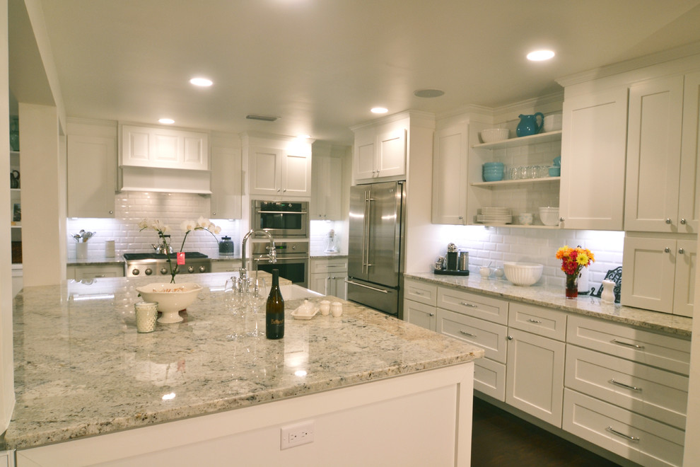 Inspiration for a transitional eat-in kitchen remodel in Miami with shaker cabinets, white cabinets, quartz countertops, an island and gray countertops