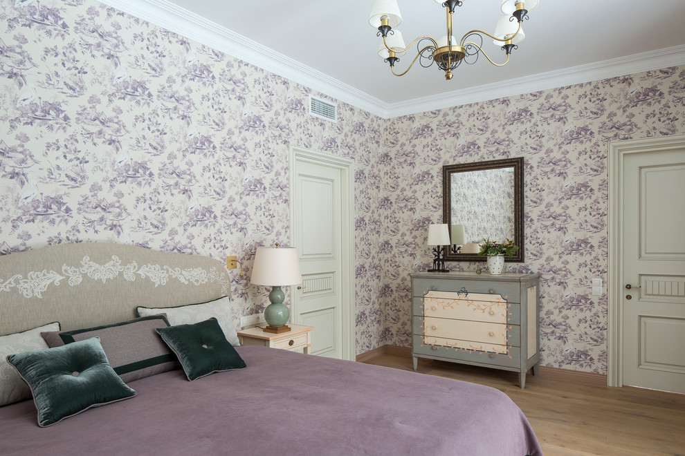 Inspiration for a traditional master bedroom in Moscow with light hardwood floors.