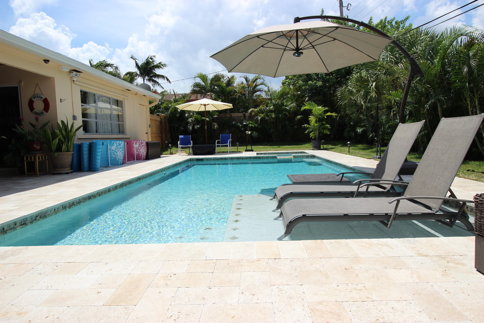 Inspiration for a mid-sized transitional pool remodel in Miami