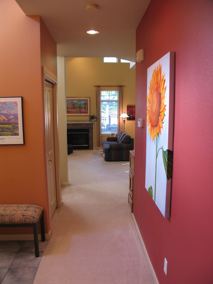 Mid-sized contemporary entry hall in Seattle with multi-coloured walls and vaulted.