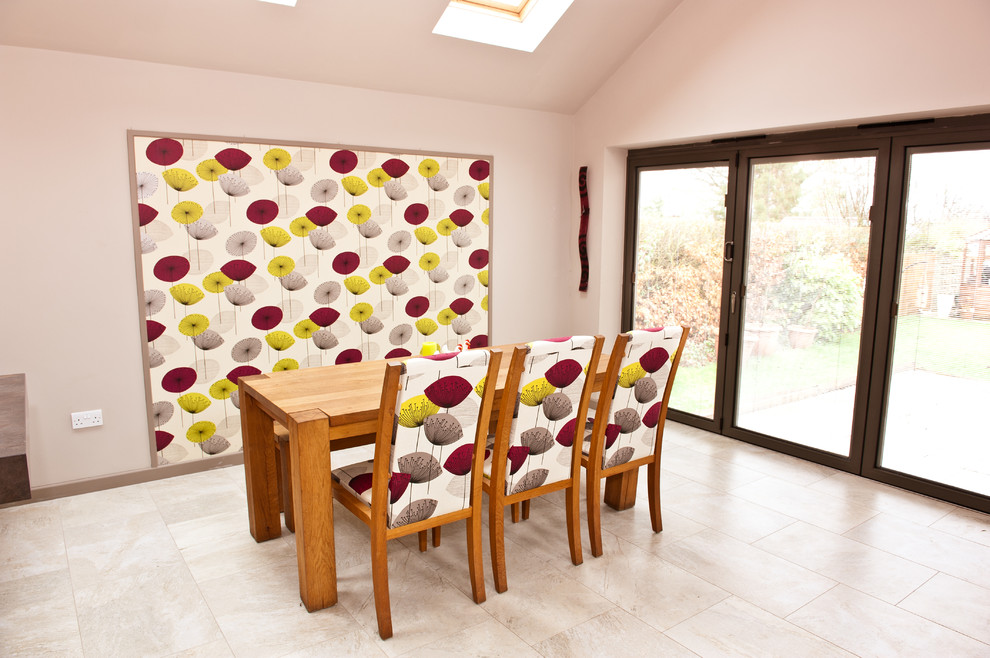 Contemporary dining room in Cambridgeshire with grey walls.