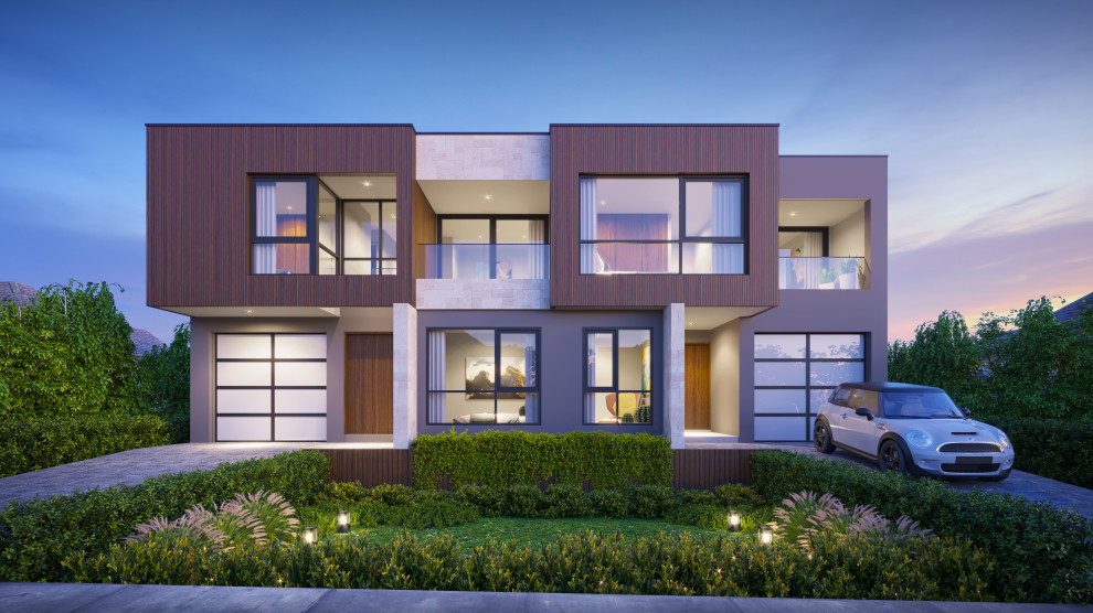 Photo of a large contemporary two-storey duplex exterior in Sydney with stone veneer and a metal roof.