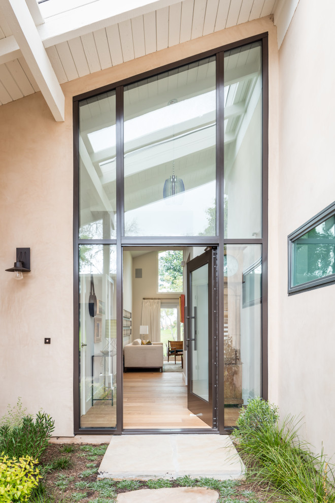 This is an example of a mid-sized midcentury entryway in Orange County.