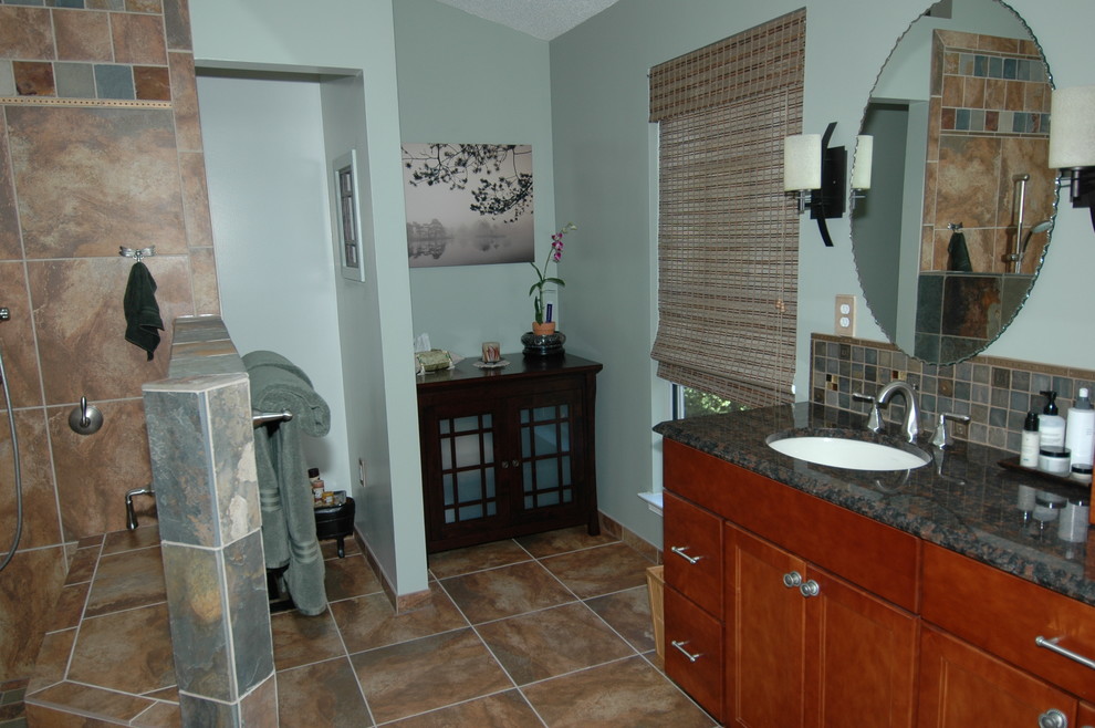 Photo of a large contemporary master bathroom in DC Metro with medium wood cabinets and granite benchtops.