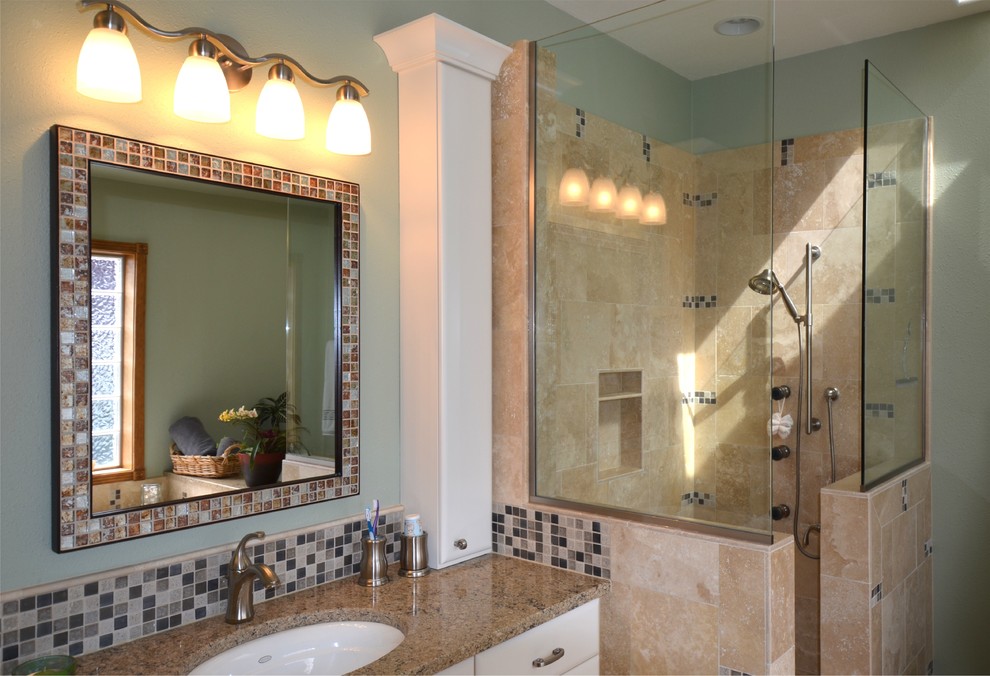 Beach style bathroom in Portland with an open shower, white cabinets and beige tile.