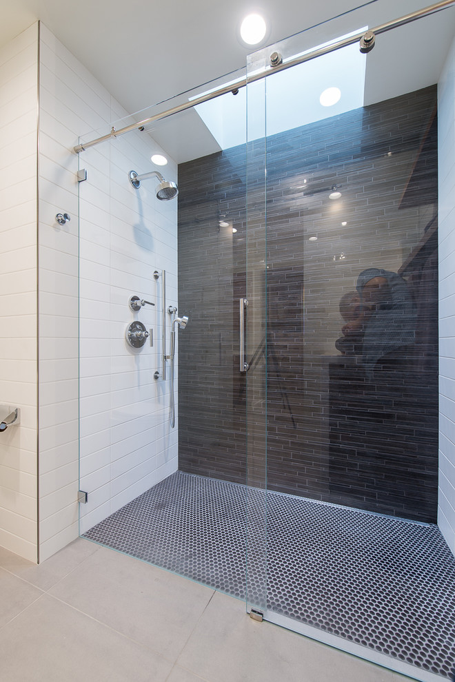 Inspiration for a mid-sized contemporary master bathroom in San Francisco with flat-panel cabinets, medium wood cabinets, an alcove shower, gray tile, matchstick tile, beige walls, porcelain floors and an undermount sink.