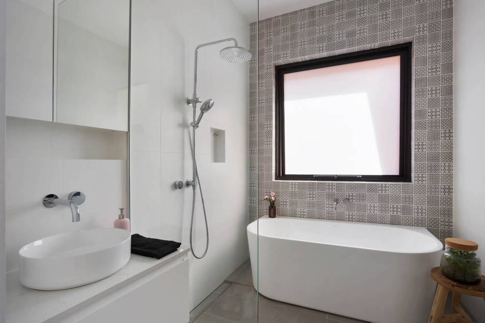 Inspiration for a contemporary wet room bathroom in Sydney with flat-panel cabinets, white cabinets, a freestanding tub, gray tile, a vessel sink, grey floor, an open shower, white benchtops, a single vanity and a floating vanity.