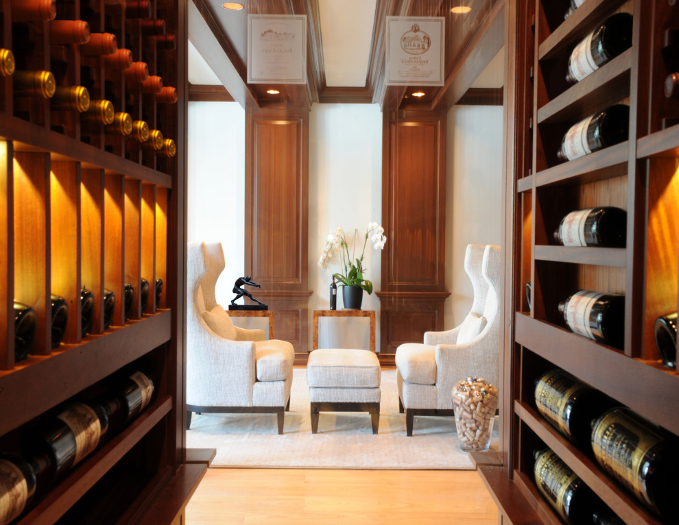 Design ideas for a large traditional wine cellar in DC Metro with marble floors, display racks and yellow floor.