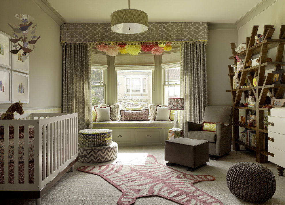 Design ideas for a large transitional nursery for girls in San Francisco with beige walls and carpet.