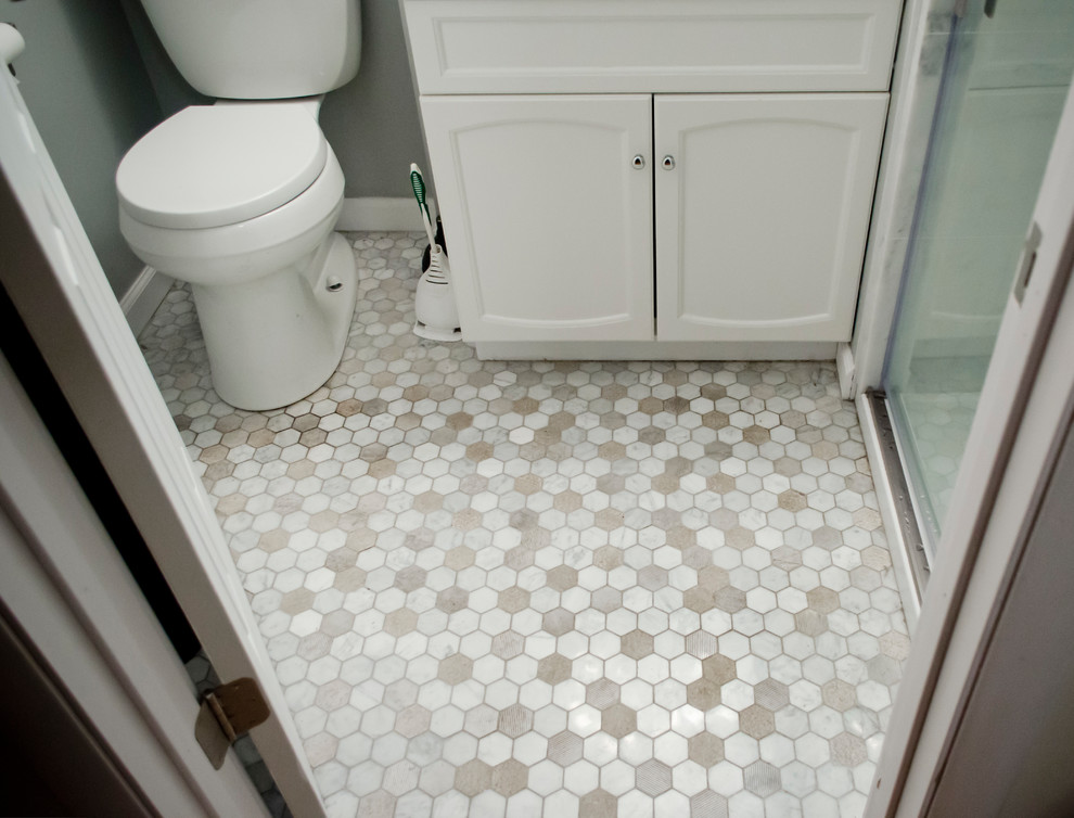 Inspiration for a small transitional master white tile and marble tile mosaic tile floor alcove shower remodel in Chicago with shaker cabinets, white cabinets, a two-piece toilet, gray walls, an integrated sink and marble countertops