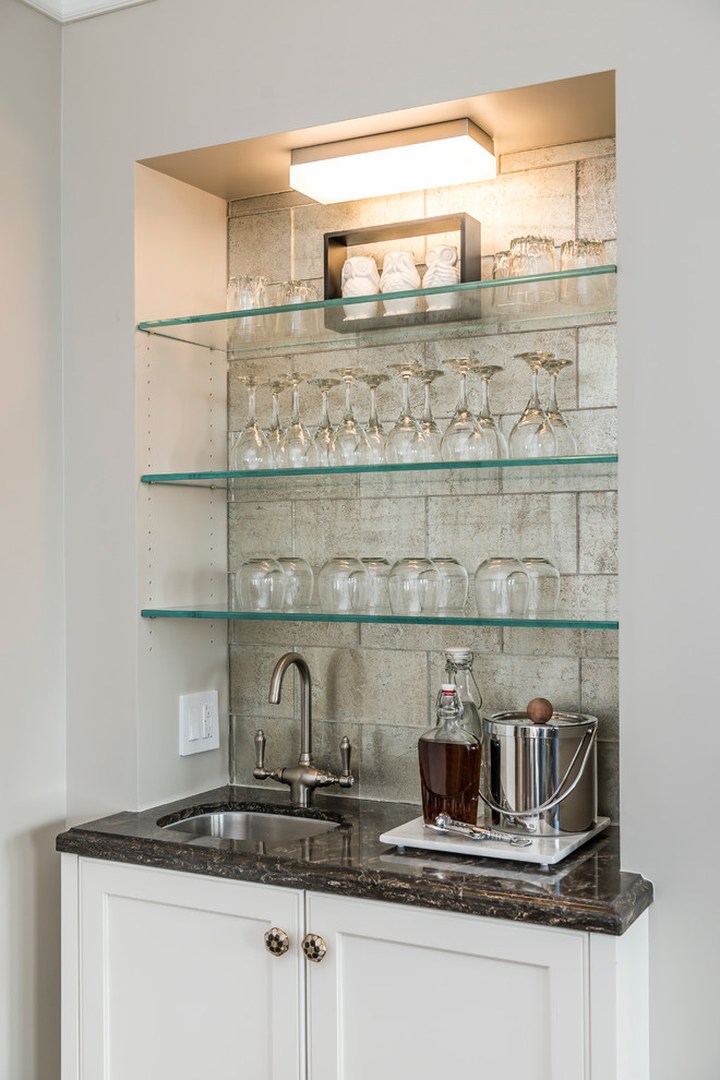 Mid-sized transitional wet bar in San Francisco with an undermount sink, white cabinets, marble benchtops, multi-coloured splashback, glass tile splashback and medium hardwood floors.