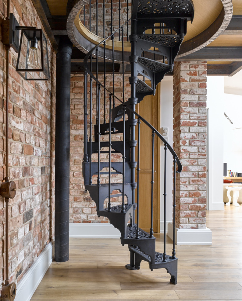 This is an example of a small metal spiral staircase in Other with metal risers.