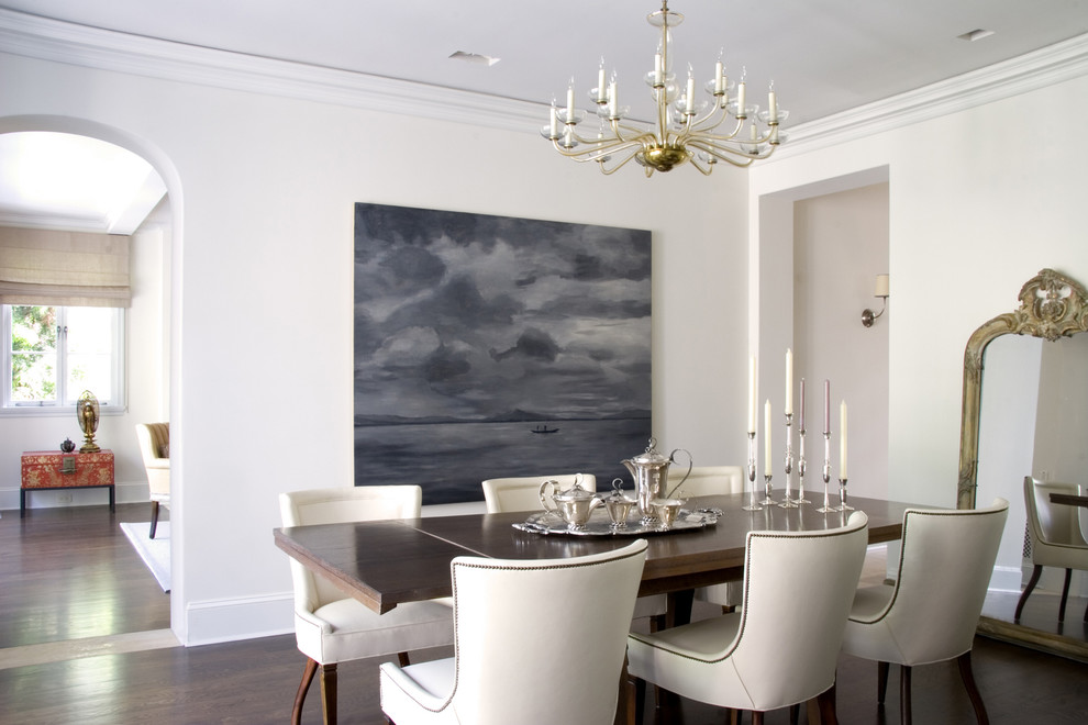 Transitional dining room in Los Angeles with white walls and dark hardwood floors.