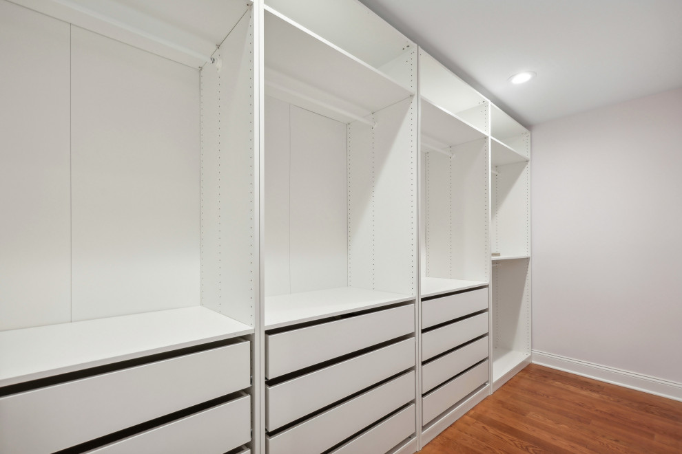 Walk-In Closet with Drawer Bank and Hanging Rods