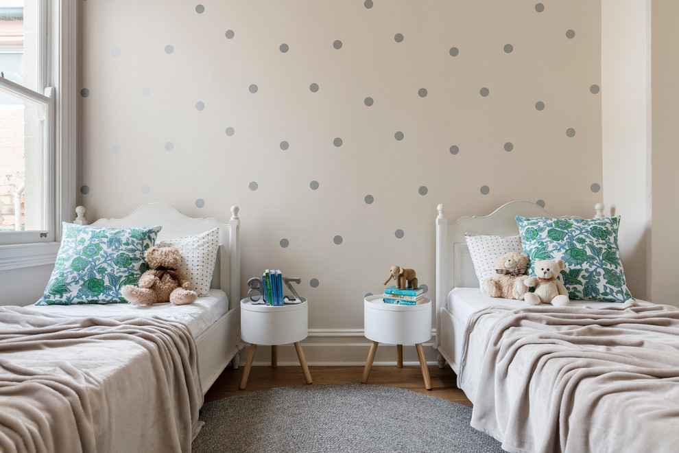 Inspiration for a mid-sized traditional kids' bedroom for kids 4-10 years old and girls in Sydney with medium hardwood floors and multi-coloured walls.