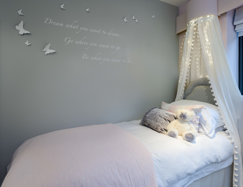 Inspiration for a mid-sized contemporary kids' bedroom for kids 4-10 years old and girls in Oxfordshire with grey walls.