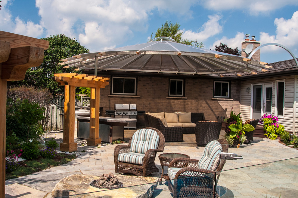 Summer Red Transitional Patio Toronto by Artistic Landscaping Inc.