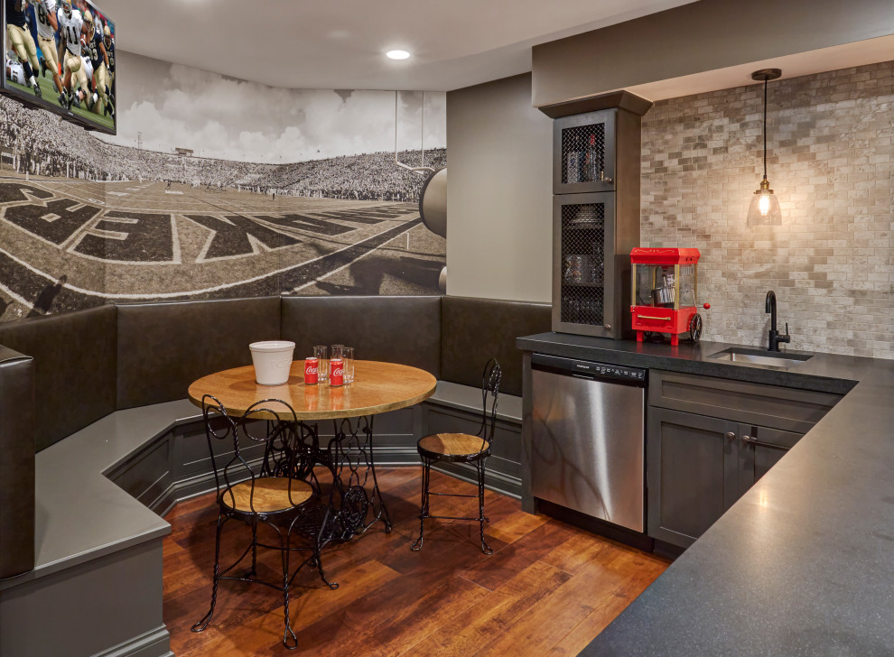 Transitional dark wood floor and brown floor basement photo in Chicago with gray walls