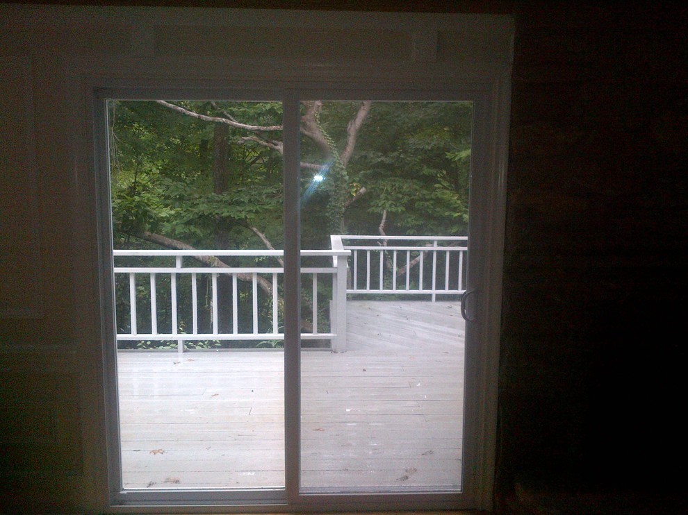 How to hang curtains over this sliding door?